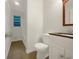 Clean bathroom with white fixtures, tile floors, and a shower/tub combo at 4261 E Conley Rd, Conley, GA 30288