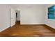 Bedroom featuring hardwood flooring, white painted walls, and large window at 4261 E Conley Rd, Conley, GA 30288