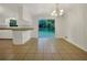 Bright dining area with chandelier, tile floors, and sliding glass doors to the backyard at 4261 E Conley Rd, Conley, GA 30288