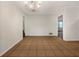 Open dining room featuring tile flooring and views into other rooms at 4261 E Conley Rd, Conley, GA 30288