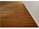 Close-up of wood flooring, freshly painted neutral walls, and painted baseboards at 4261 E Conley Rd, Conley, GA 30288