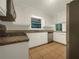 Well-lit kitchen with white cabinets, stainless steel appliances, and granite countertops at 4261 E Conley Rd, Conley, GA 30288