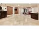 Finished basement with open layout, columns, a wet bar, and a media area at 818 Forest Path Ln, Alpharetta, GA 30022