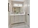 Stylish bathroom with dual sink vanity, modern fixtures, and elegant tile flooring at 818 Forest Path Ln, Alpharetta, GA 30022