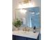 Elegant bathroom featuring modern vanity, gold fixtures, large mirror, and a luxurious shower at 818 Forest Path Ln, Alpharetta, GA 30022