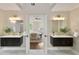 Beautiful bathroom with dual vanities, modern fixtures, and an open view into the bedroom at 818 Forest Path Ln, Alpharetta, GA 30022