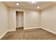 Neutral bedroom featuring plush carpet, recessed lighting, and fresh white trim at 818 Forest Path Ln, Alpharetta, GA 30022