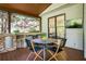 Inviting covered patio with outdoor dining area and built-in bar at 818 Forest Path Ln, Alpharetta, GA 30022