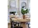 Dining room with round table, fireplace, and shelving at 818 Forest Path Ln, Alpharetta, GA 30022