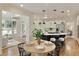 Eat-in kitchen with a large island, breakfast bar, and hardwood floors at 818 Forest Path Ln, Alpharetta, GA 30022