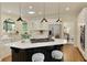 Well-lit kitchen with a center island and stainless steel appliances at 818 Forest Path Ln, Alpharetta, GA 30022