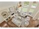Aerial view of a cozy living room featuring a fireplace, built-in shelves, and comfortable seating at 818 Forest Path Ln, Alpharetta, GA 30022