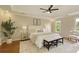 Serene main bedroom with tray ceiling, plush bed, and ample natural light from surrounding windows at 818 Forest Path Ln, Alpharetta, GA 30022