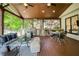 Relaxing covered patio complete with outdoor kitchen and comfortable seating area at 818 Forest Path Ln, Alpharetta, GA 30022
