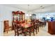 Elegant dining room with dark wood table, hutch and mirrored wall at 10202 Fairington Ridge Cir, Lithonia, GA 30038
