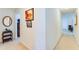 Inviting hallway with neutral walls, decorative accents and glimpses into other living spaces at 10202 Fairington Ridge Cir, Lithonia, GA 30038