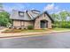 Charming clubhouse with stone accents and manicured landscaping, providing a welcoming and attractive amenity for residents at 2012 Ellison Nw Way # 15, Kennesaw, GA 30152