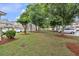 Well-maintained community green space with mature trees and lush lawn offering a serene environment for residents at 2012 Ellison Nw Way # 15, Kennesaw, GA 30152