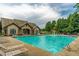 Expansive community pool with plenty of seating and a mushroom fountain, perfect for Gathering fun and relaxation at 2012 Ellison Nw Way # 15, Kennesaw, GA 30152
