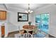 Dining area with hardwood floors, chandelier, and sliding door to the outside patio at 2012 Ellison Nw Way # 15, Kennesaw, GA 30152