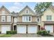 Charming townhome with stone accents, two-car garage, and well-maintained landscaping at 2012 Ellison Nw Way # 15, Kennesaw, GA 30152