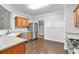 Updated kitchen features stainless steel appliances, wood cabinets, and eat-in dining area at 2012 Ellison Nw Way # 15, Kennesaw, GA 30152