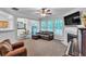 Inviting living room with fireplace, large windows, and access to dining area at 2012 Ellison Nw Way # 15, Kennesaw, GA 30152