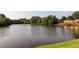 Scenic view of the pond surrounded by lush greenery, offering a tranquil and picturesque setting for residents at 2012 Ellison Nw Way # 15, Kennesaw, GA 30152