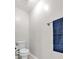 A bright shot of a standard white toilet, complete with a towel rack and blue towel nearby at 2012 Ellison Nw Way # 15, Kennesaw, GA 30152