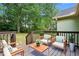 Relaxing back deck with outdoor seating overlooking the lush green backyard at 2074 Hilburn Se Dr, Atlanta, GA 30316