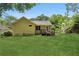 View of the home's backyard with a lush lawn, wooden deck, and fenced-in area, perfect for outdoor activities at 2074 Hilburn Se Dr, Atlanta, GA 30316