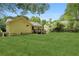Exterior shot of a home featuring a spacious, well-maintained backyard and deck at 2074 Hilburn Se Dr, Atlanta, GA 30316