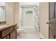 Well-maintained bathroom with tiled floor, shower and granite vanity at 2074 Hilburn Se Dr, Atlanta, GA 30316