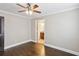 Bedroom leading to ensuite bathroom featuring dark hardwood floors and neutral walls at 2074 Hilburn Se Dr, Atlanta, GA 30316