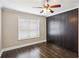 Bedroom featuring dark hardwood floors, a ceiling fan, and large closet system at 2074 Hilburn Se Dr, Atlanta, GA 30316
