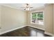 Bedroom with hardwood floors and a large window overlooking the backyard at 2074 Hilburn Se Dr, Atlanta, GA 30316