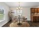 Inviting dining area with modern chandelier and ample natural light at 2074 Hilburn Se Dr, Atlanta, GA 30316