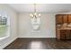 Bright dining room with a large window and dark wood floors at 2074 Hilburn Se Dr, Atlanta, GA 30316