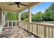 Spacious front porch with stone flooring and a classic white railing at 2074 Hilburn Se Dr, Atlanta, GA 30316