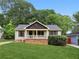 Charming single-story home with a well-manicured front yard and inviting front porch at 2074 Hilburn Se Dr, Atlanta, GA 30316