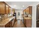 Updated kitchen with granite countertops, stainless steel appliances, and mosaic backsplash at 2074 Hilburn Se Dr, Atlanta, GA 30316