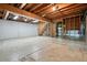 Unfinished basement offers lots of space and potential, with exposed wood beams and access to stairs at 2900 Country Nw Ct, Kennesaw, GA 30152