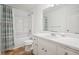 Bright bathroom features a shower-tub combo, toilet, and a vanity with sink at 2900 Country Nw Ct, Kennesaw, GA 30152