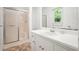 Clean bathroom featuring a tiled floor, glass shower, and vanity at 2900 Country Nw Ct, Kennesaw, GA 30152