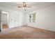 Spacious bedroom features a ceiling fan and large window with plenty of natural light at 2900 Country Nw Ct, Kennesaw, GA 30152