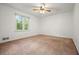 Bright bedroom with a ceiling fan, a large window, and plenty of natural light at 2900 Country Nw Ct, Kennesaw, GA 30152