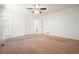 The carpeted bedroom has multiple closets and doors at 2900 Country Nw Ct, Kennesaw, GA 30152