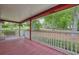 Long front porch showcasing painted flooring, and white railings with a nice view at 2900 Country Nw Ct, Kennesaw, GA 30152