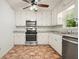 Modern kitchen featuring stainless steel appliances, white cabinets, and granite countertops at 2900 Country Nw Ct, Kennesaw, GA 30152