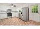 Well-lit kitchen with white cabinets, stainless steel appliances, and granite countertops at 2900 Country Nw Ct, Kennesaw, GA 30152